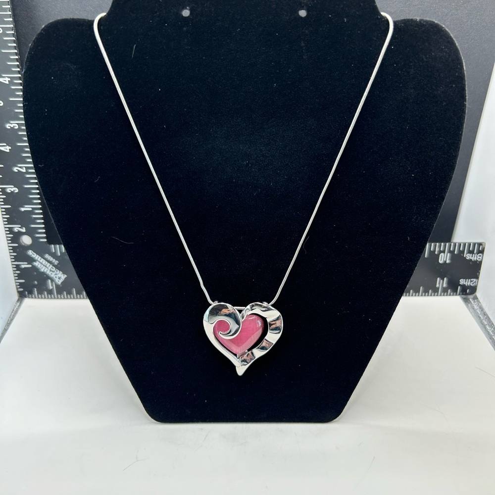 Silvertone and pink heart pendant necklace approximately 10 inches long